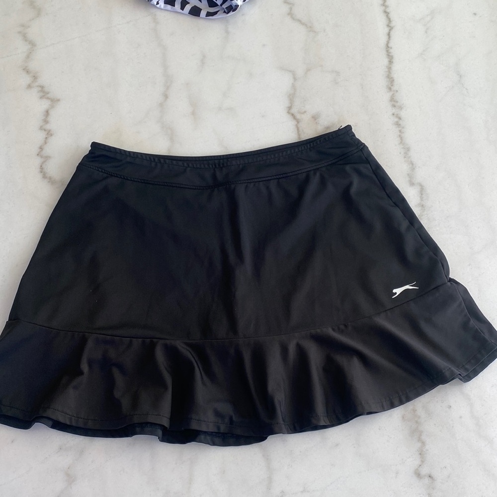 Black casual skirt with black built in shorts. Flounce bottom for added flair